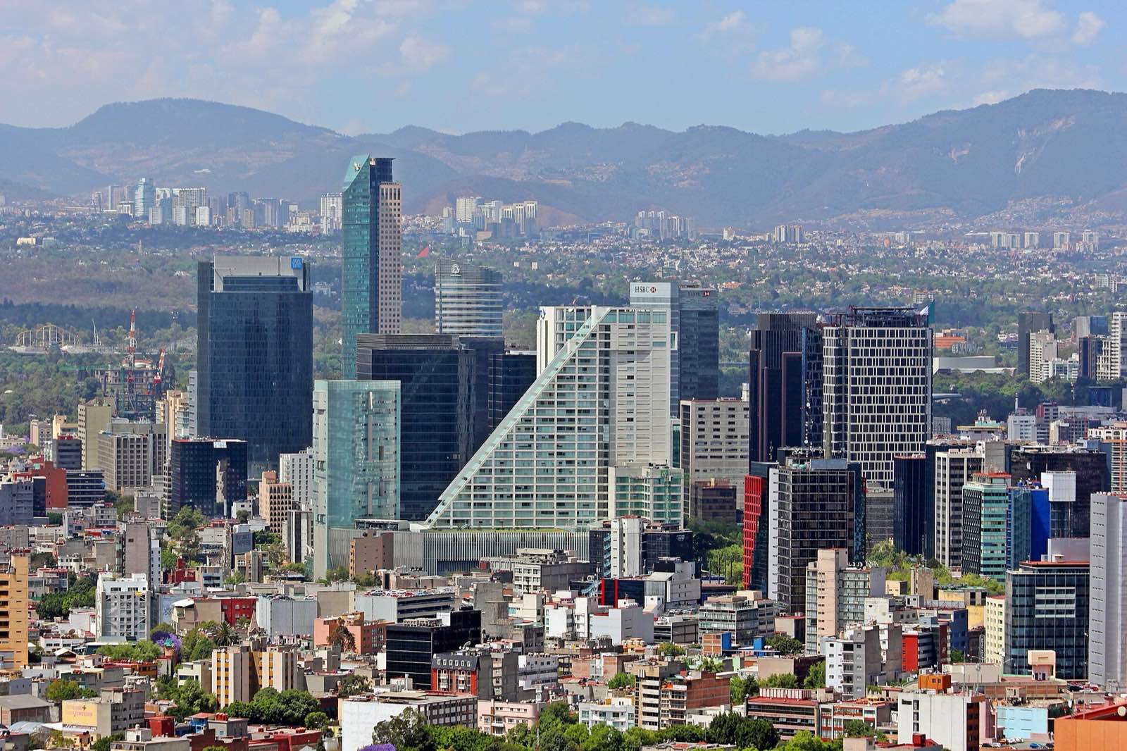 A row of modern towers along Paseo de la Reforma in Mexico City.