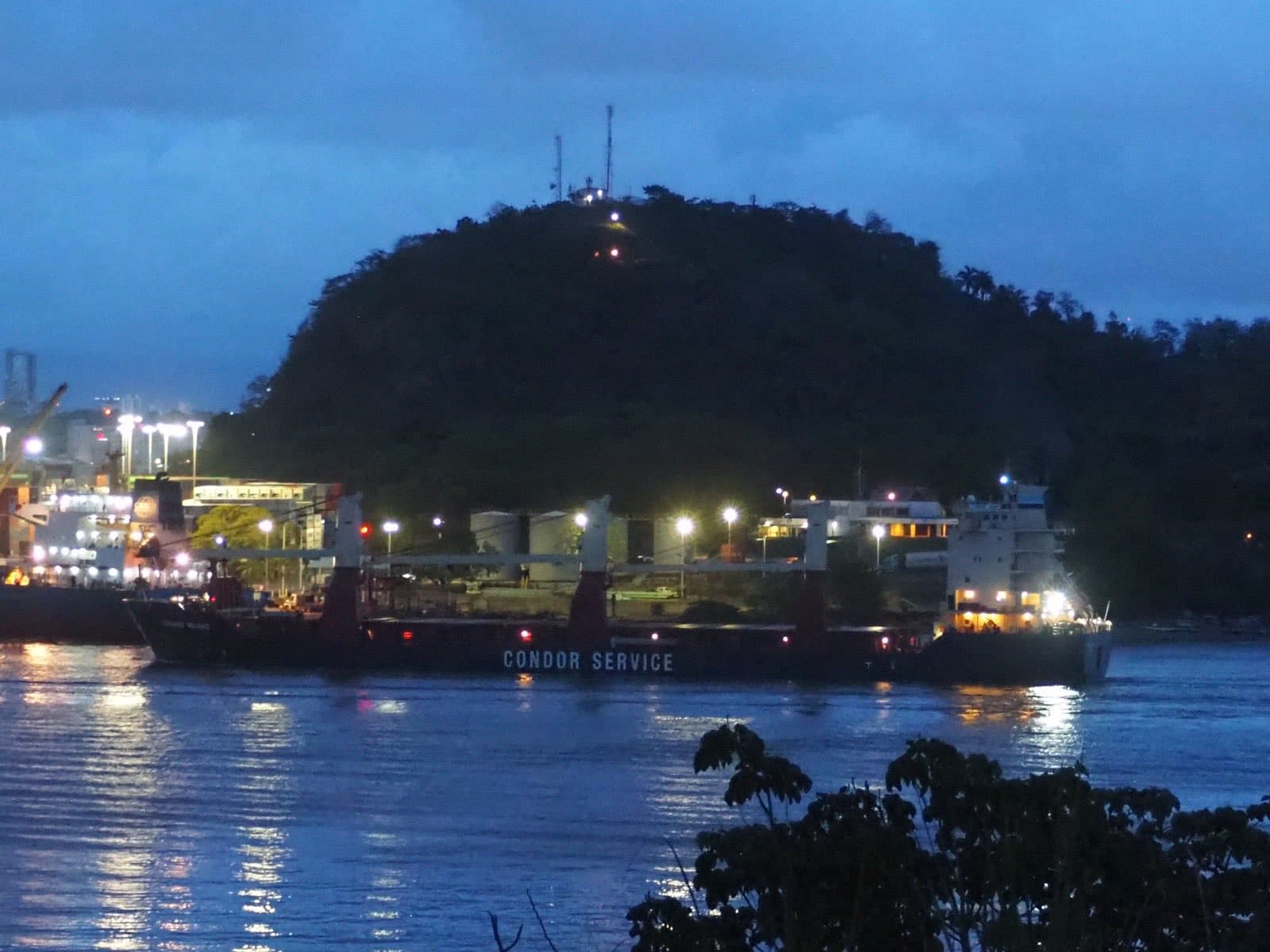 The Panama Canal with a green hillside in the background
