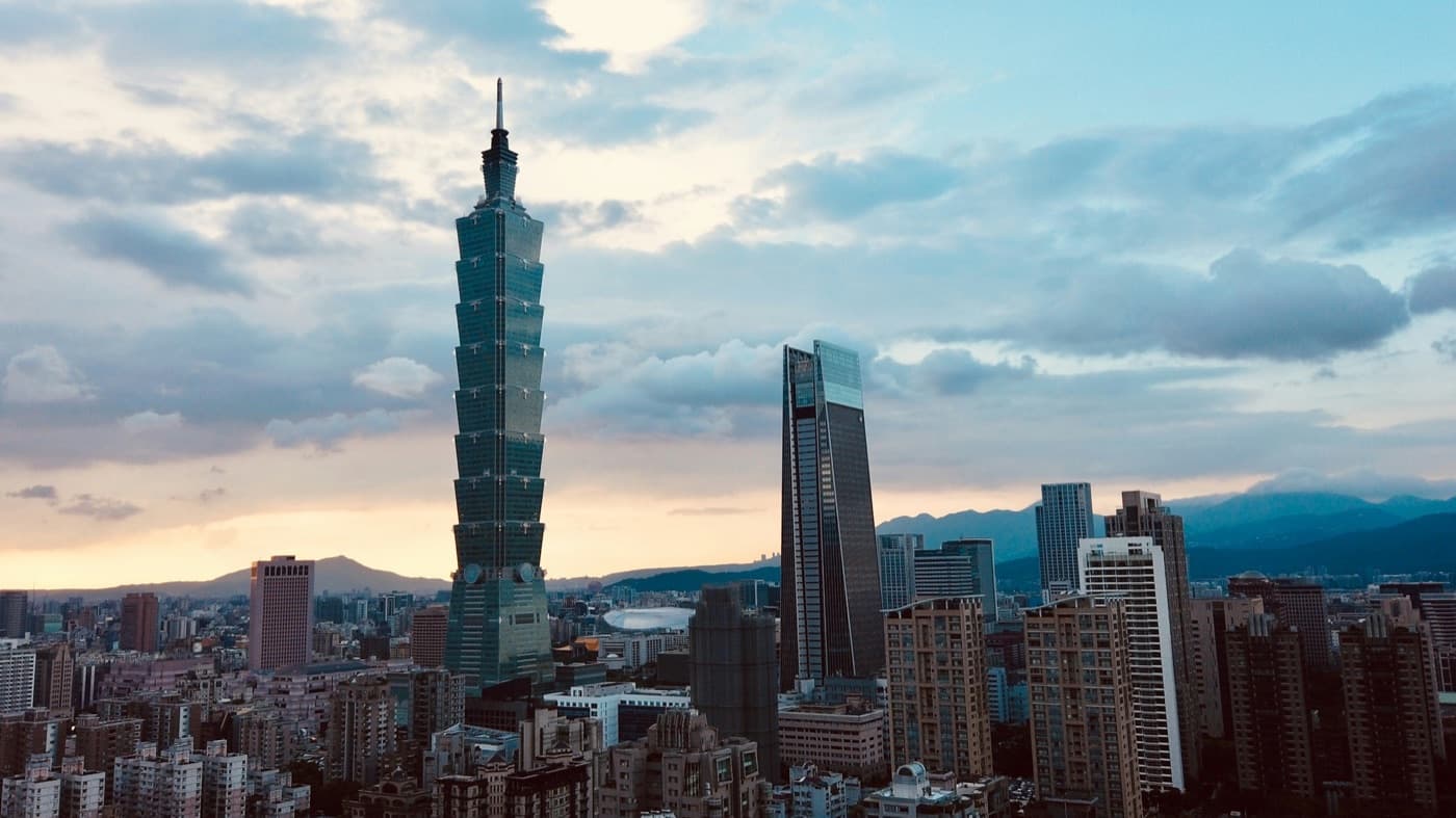 Taipei 101 rising above the Taipei skyline at dusk